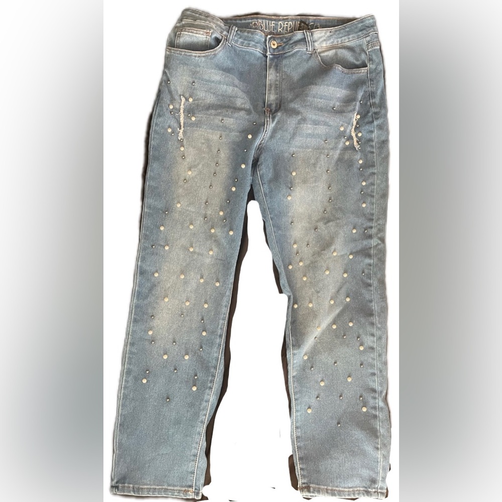 Medium wash stretch straight leg blue jeans embellished with faux peals